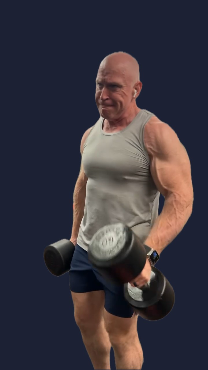 David performing a dumbbell curl
